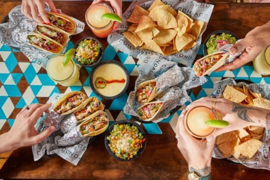 A group enjoys dips, tacos and Margaritas at Condado Tacos in Ballpark Village.