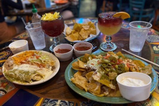 A spread of Mexican dishes covers a table at El Burro Loco in the Central West End.