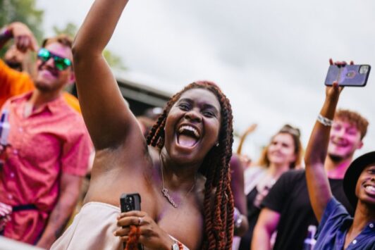 A festivalgoer dances at Evolution Festival in Forest Park.