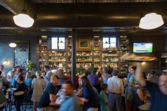 The bar at Frisco Barroom bustles with guests.