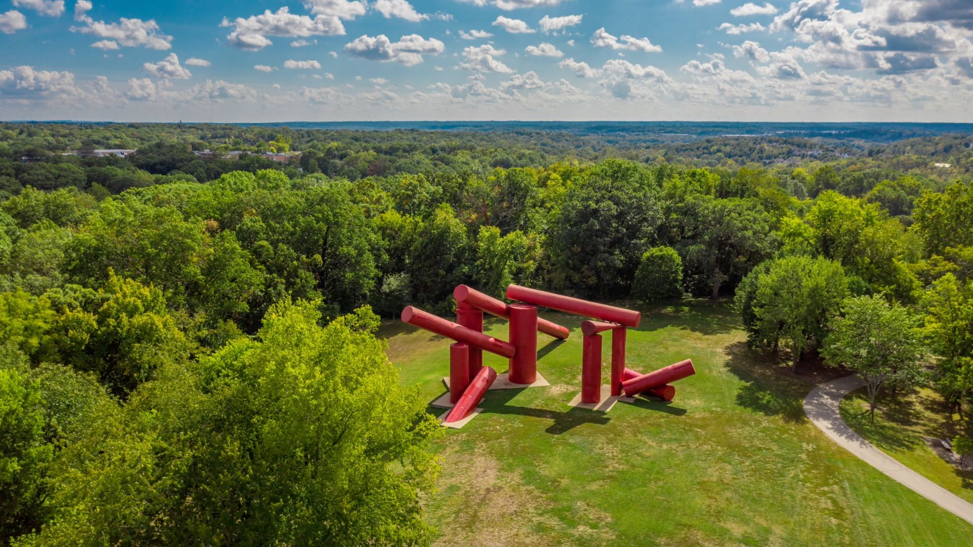 The Way, an outdoor sculpture at Laumeier Sculpture Park, features giant red cylinders.