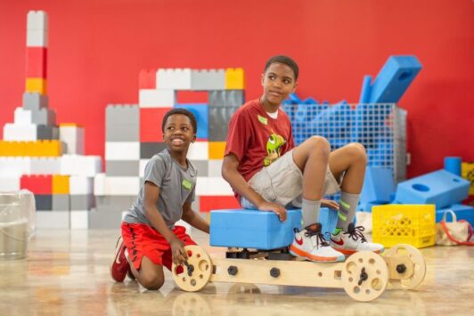 Two boys get craft at MADE for Kids.