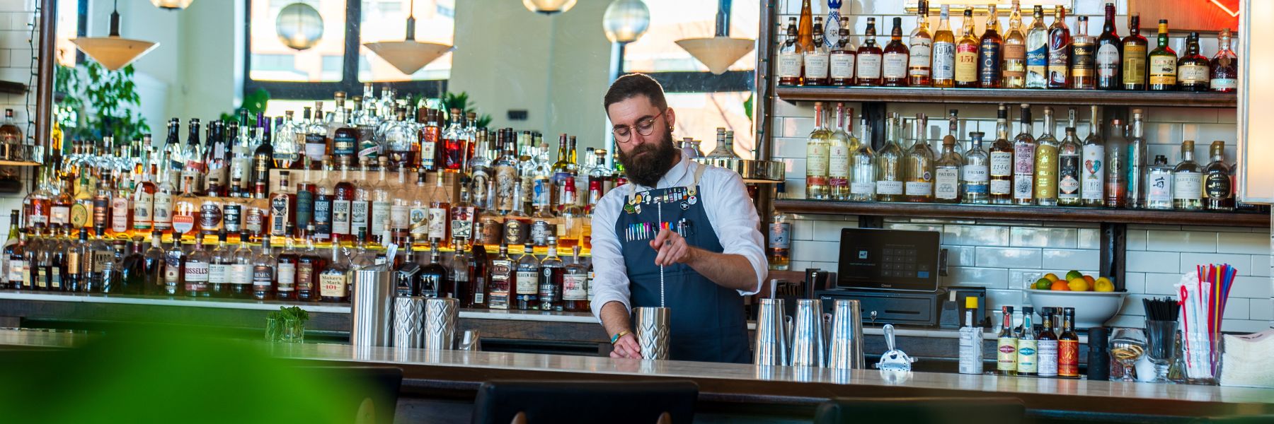 Bar manager Jeramy White mixes drinks at Olive and Oak.