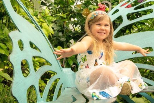 A little girl enjoys herself at the Sophia M Sachs Butterfly House during 48 hours in St Louis.