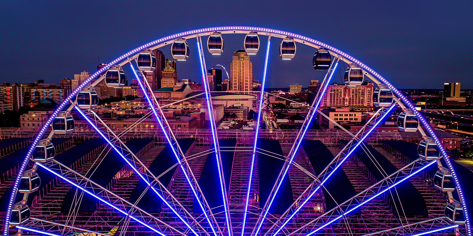 The St. Louis Wheel at Union Station glowing against the nighttime St. Louis skyline.